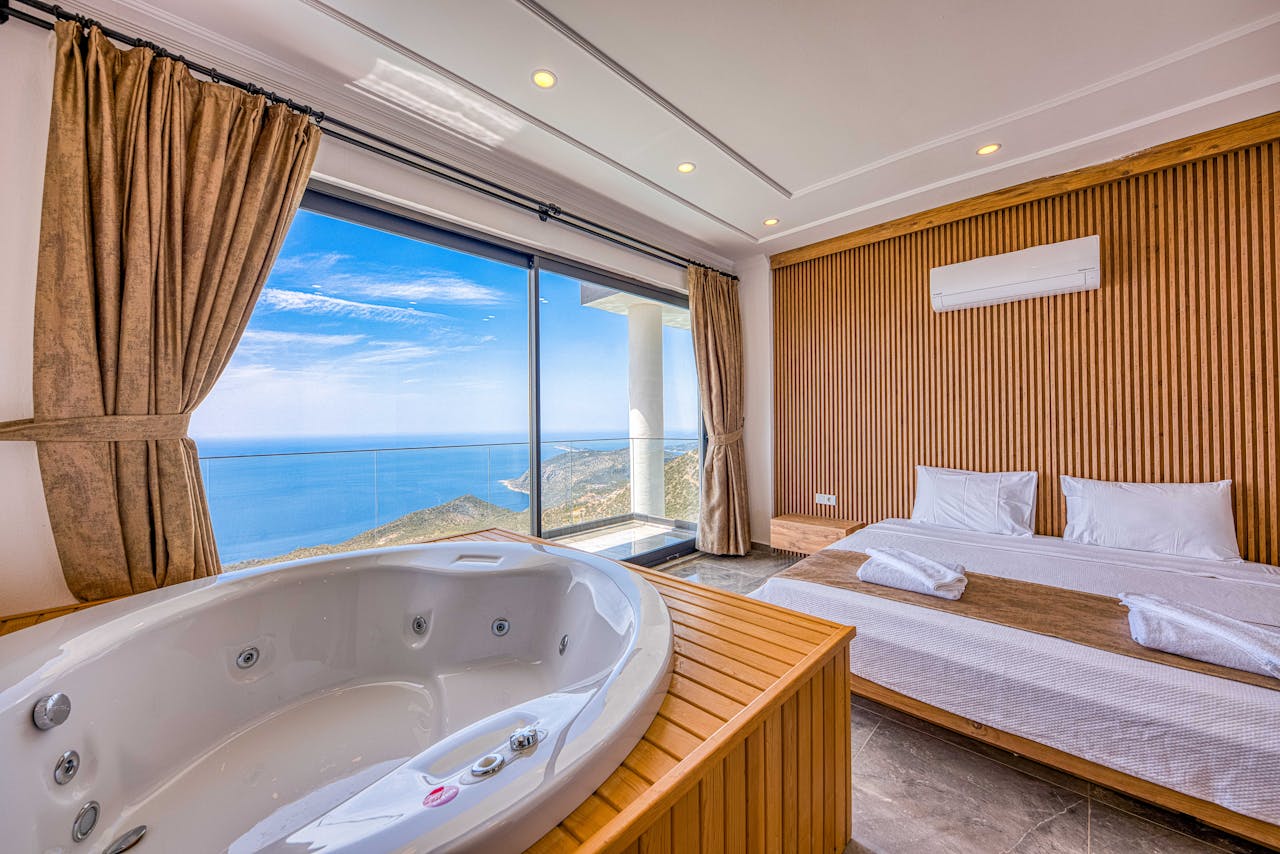 Elegant Miami hotel suite with floor-to-ceiling windows overlooking the ocean