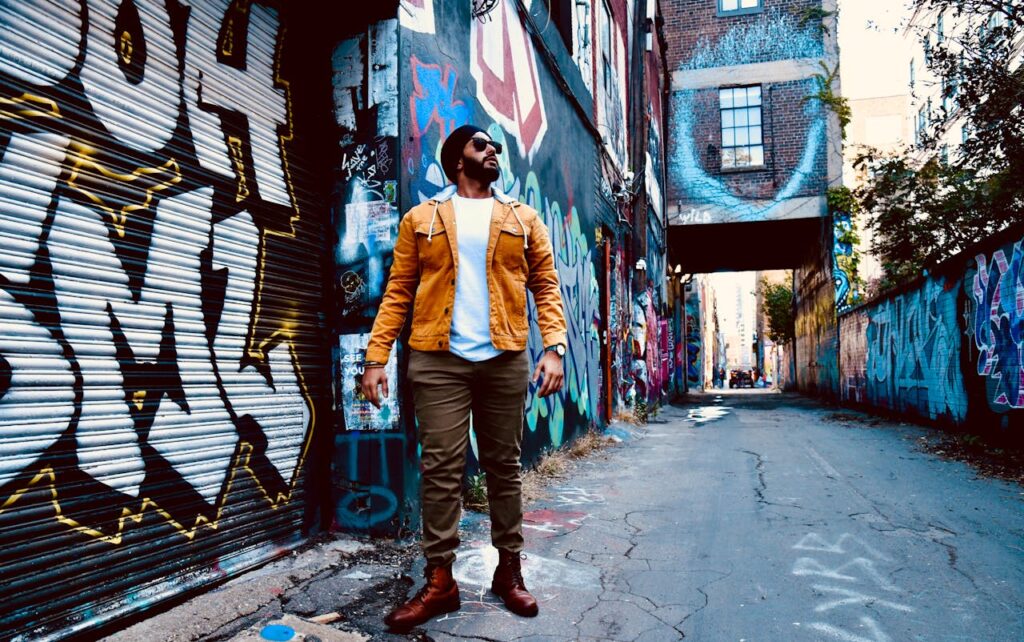 Colorful murals and people walking along Wynwood’s main avenue