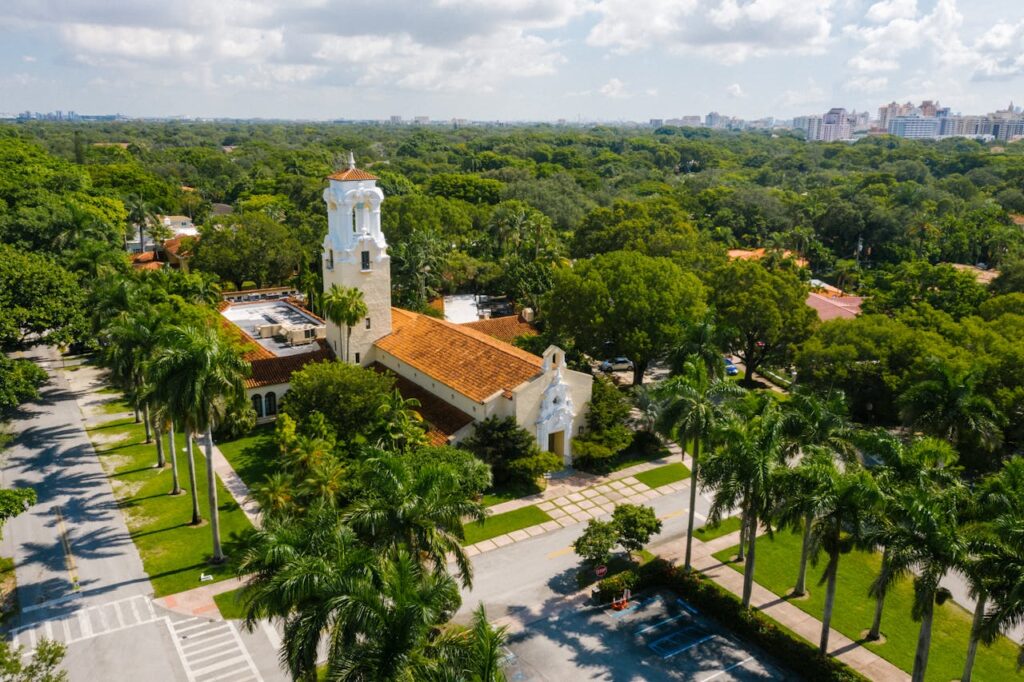 Aerial view of Coconut Grove in Miami showing lush greenery and Biscayne Bay