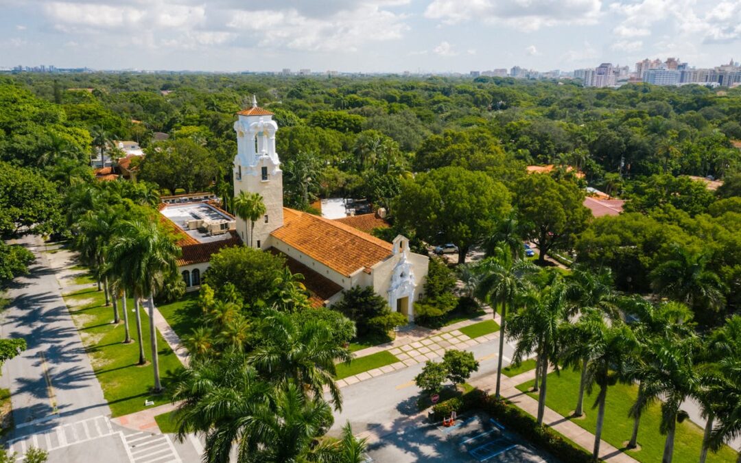 Aerial view of Coconut Grove in Miami showing lush greenery and Biscayne Bay